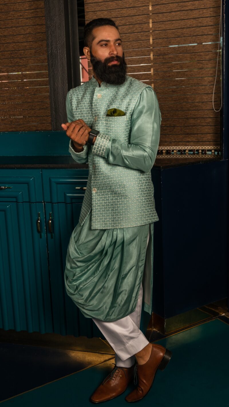 Green draped kurta with a self textured waistcoat