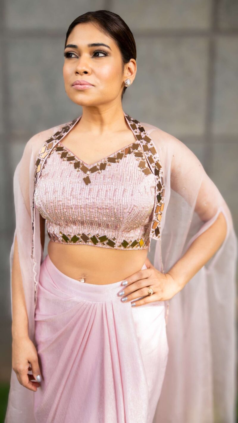 Draped skirt paired with hand embellished crop top and a throw